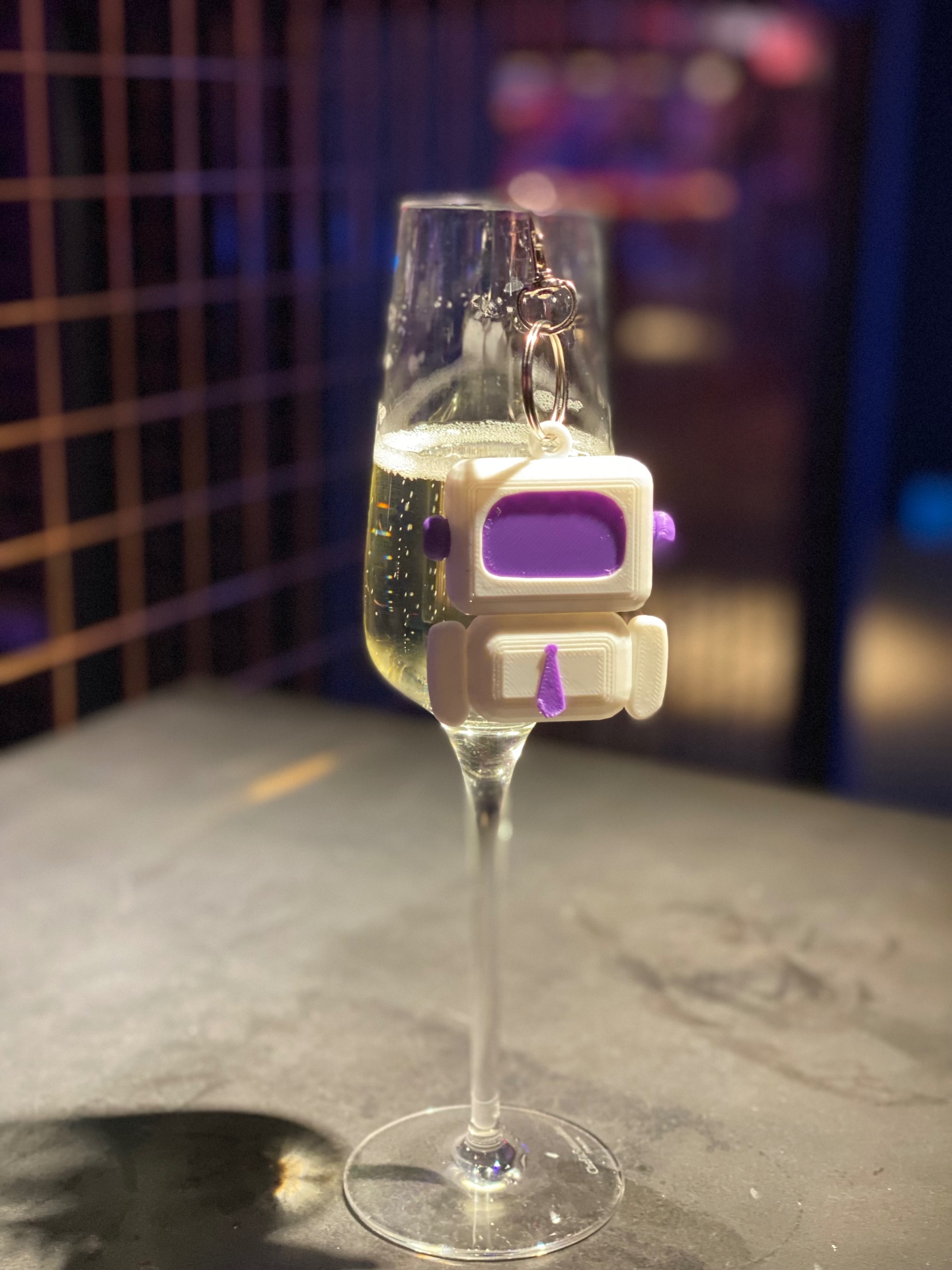 Arty hanging from the rim of a champagne flute